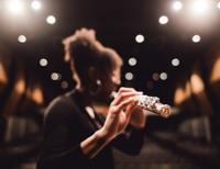 A student playing a musical instrument