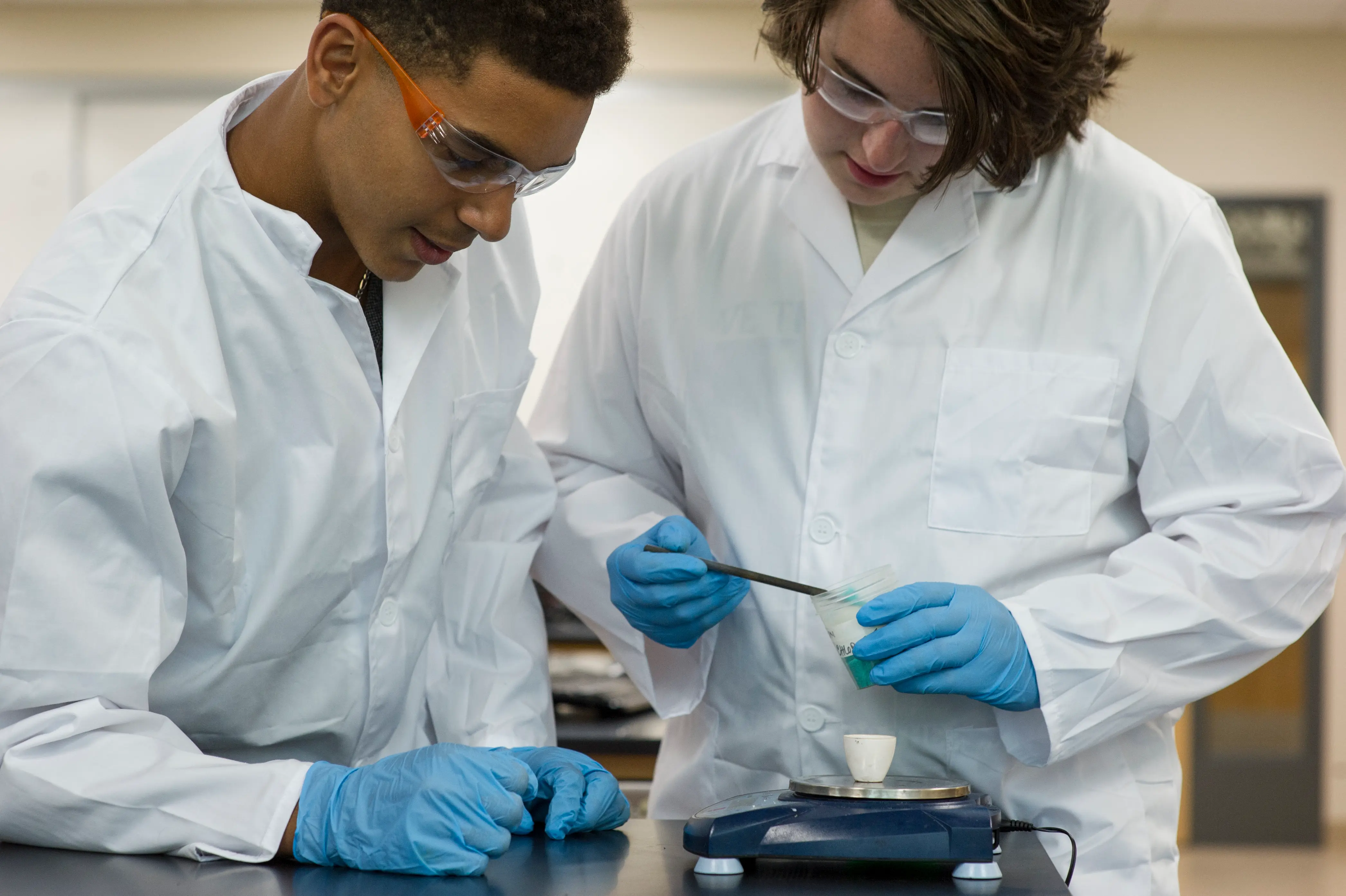 2 roberts students weighing something 
