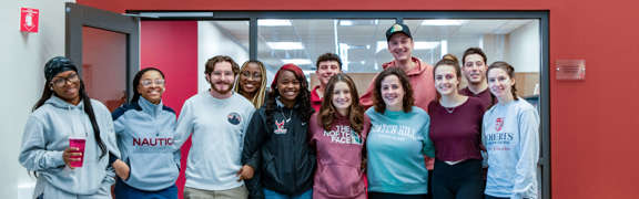 students at roberts in front of character education sign