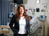 A nurse leader smiles