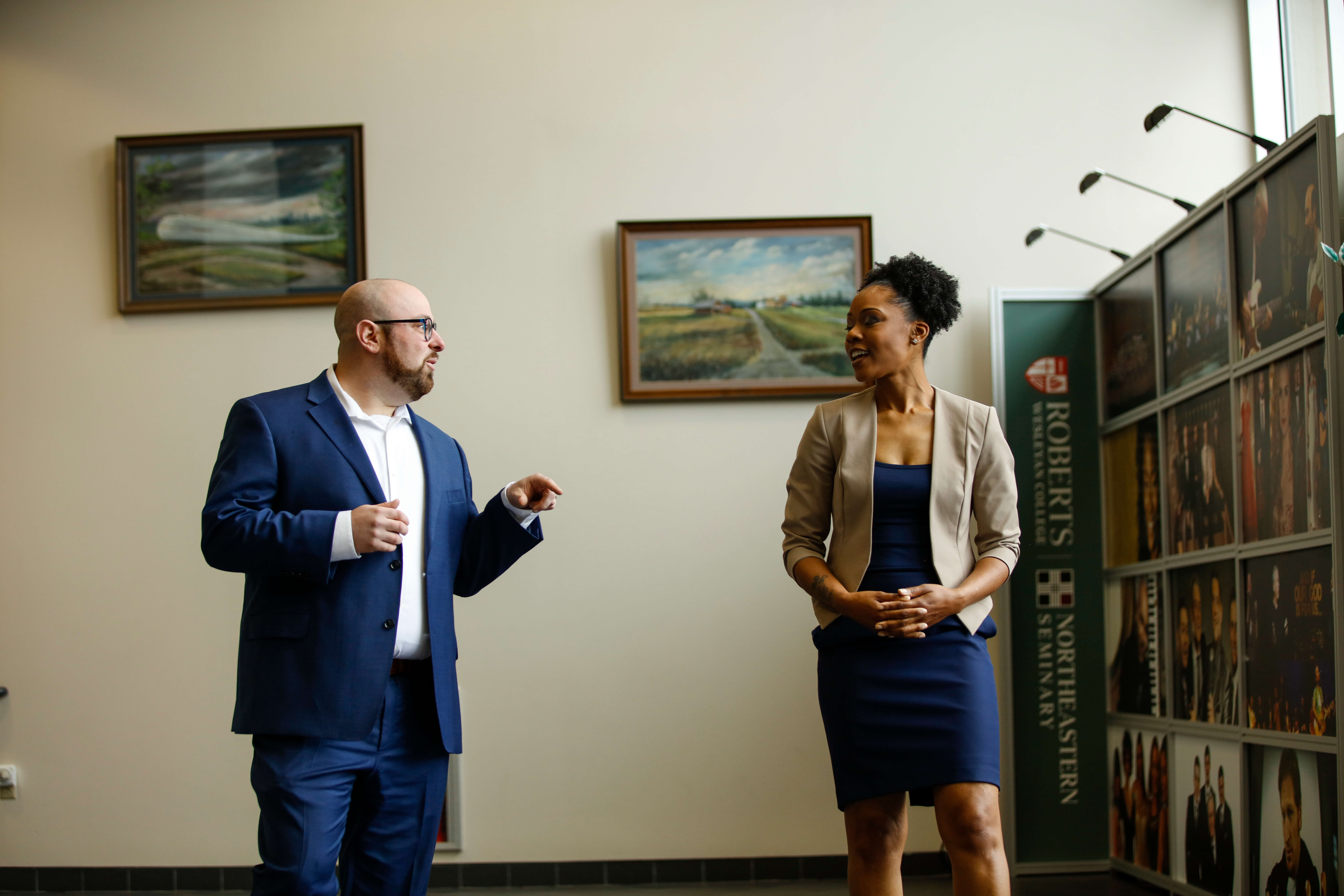 Two graduate students talking to each other