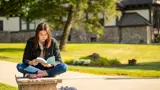 Student reads outside