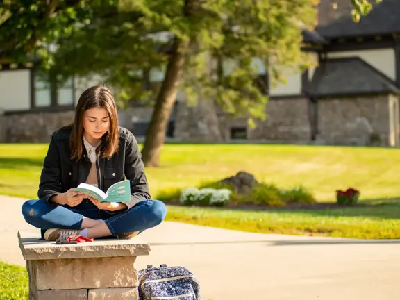 Student reads outside